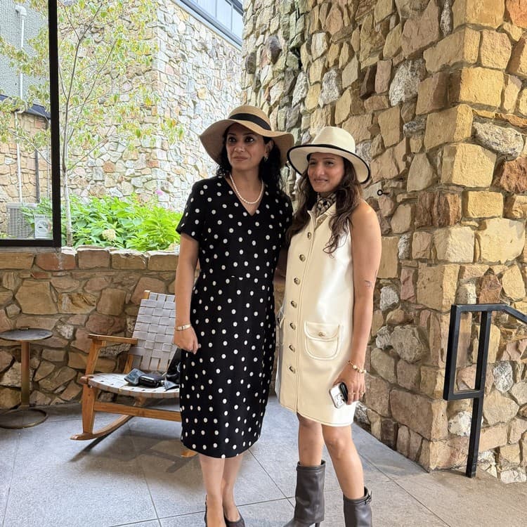 Priyanka and Neeta Kumar in hats at Keeneland