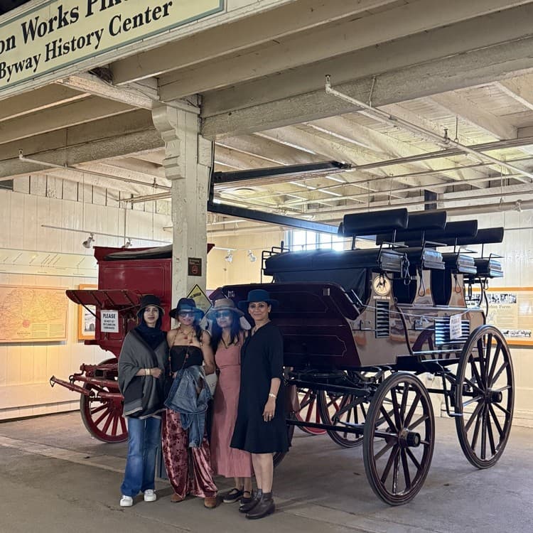 The ladies of the party with a carriage at the International Museum of the Horse